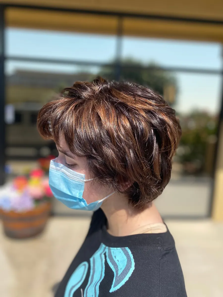 Short layered brunette cut with copper dimension