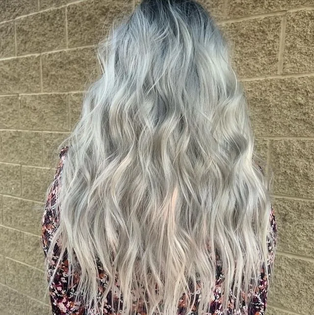 Icy silver blonde waves with a shadowed root