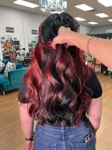 Black hair with bold red peekaboo panels