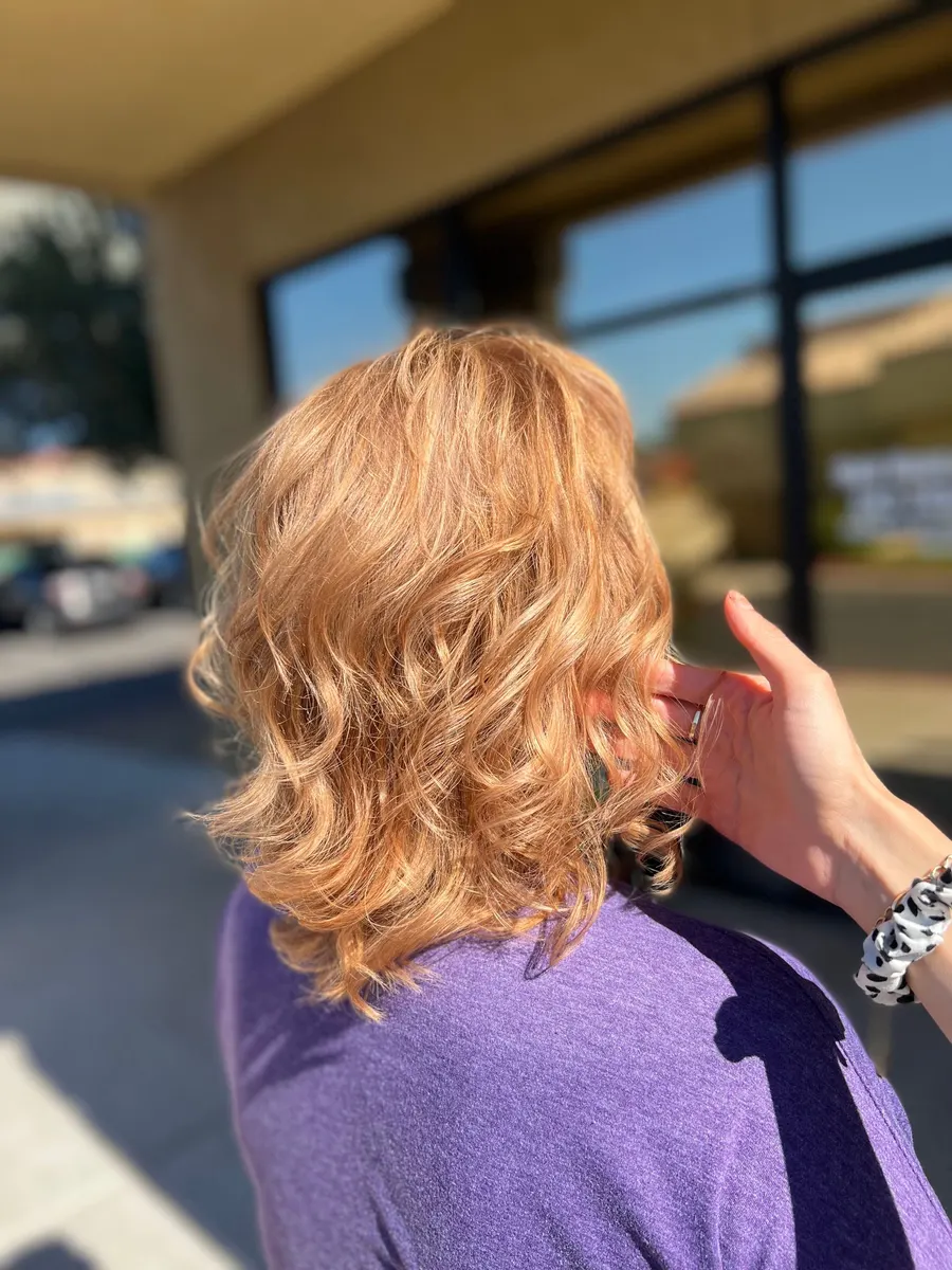 Golden copper hair with volume