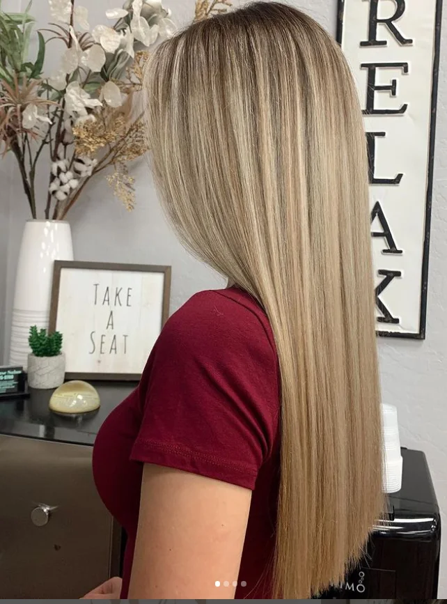 Long, sleek straight blonde hair with soft dimension