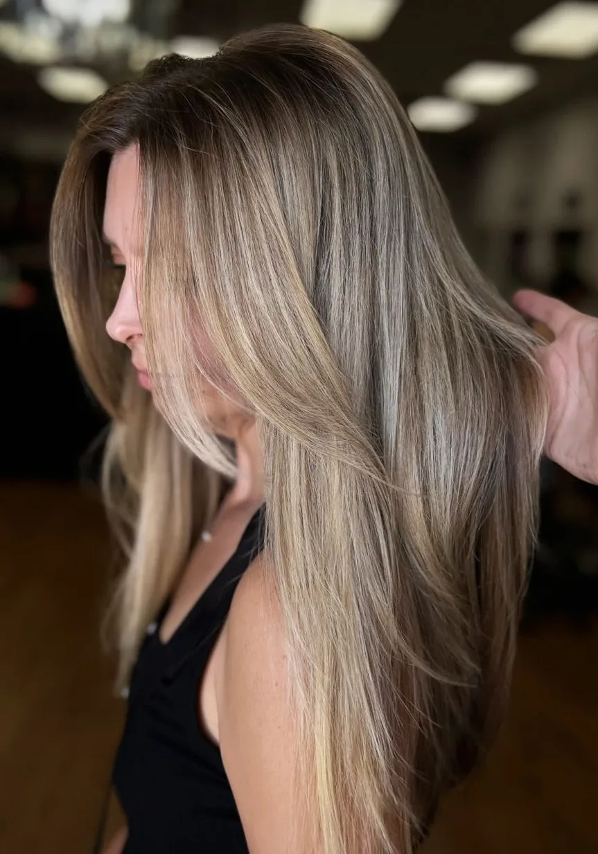 Long, sleek blended blonde with a darker root